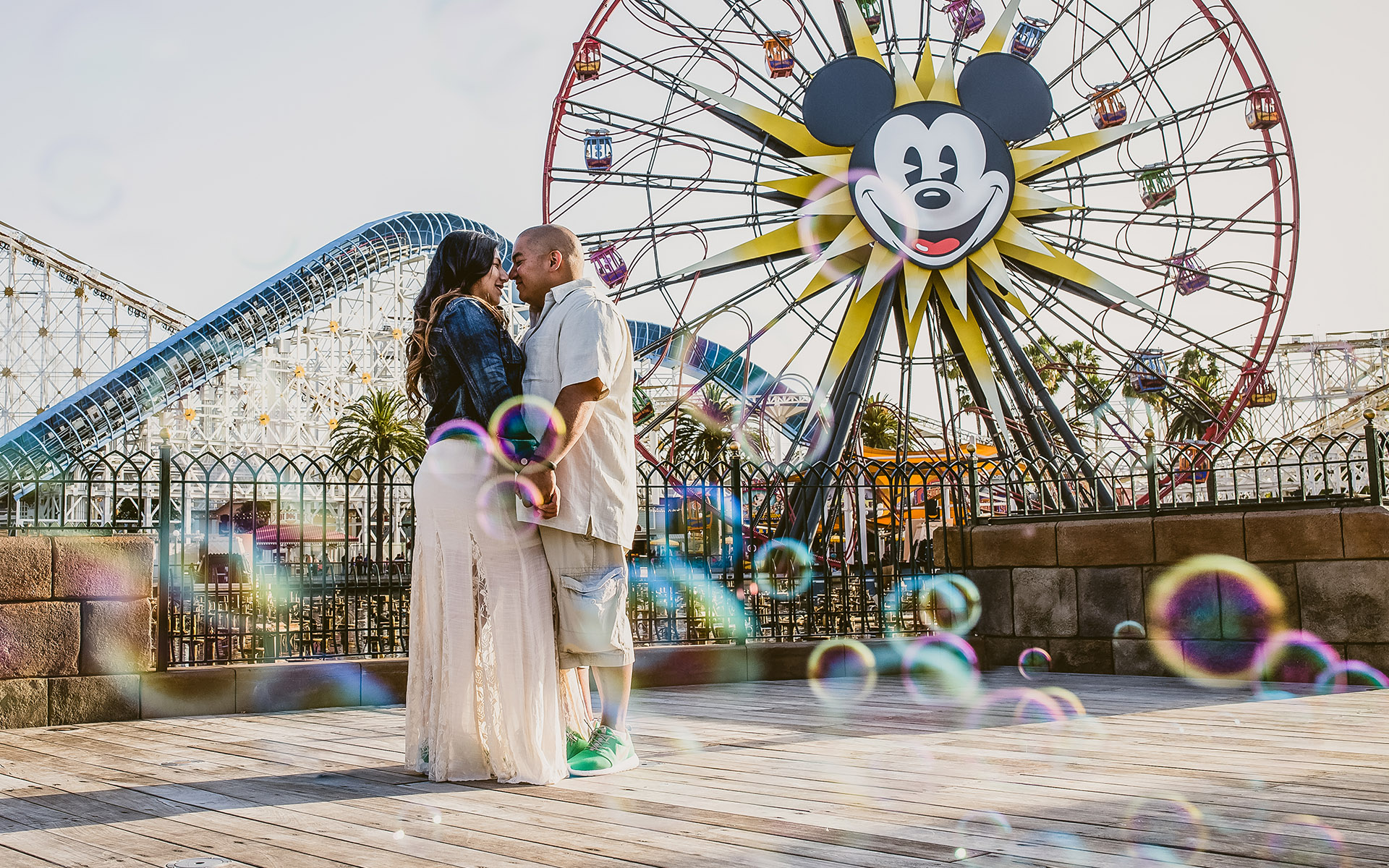 engagement at disneyland with bubbles california adventure mickey mouse ferris wheel